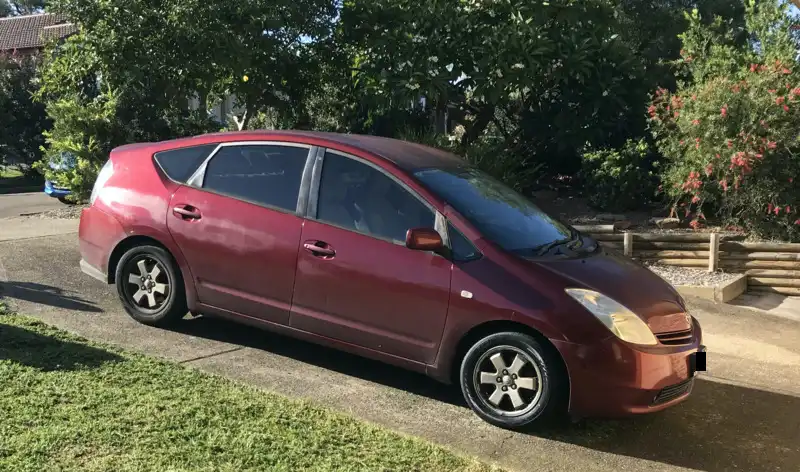 red prius in driveway